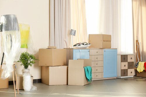 Professional packers organizing items for a move in Ilford storage