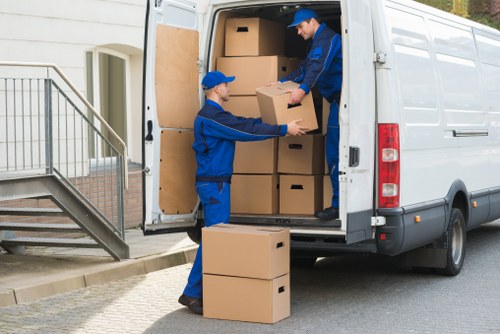 Professional movers packing household items
