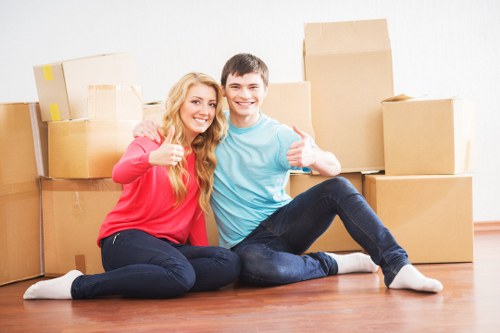 Experienced team handling delicate items during packing